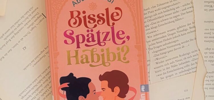 Das Buch "Bissle Spätzle, Habibi?" von Abla Alaoui liegt auf einem Hintergrund aus Buchseiten